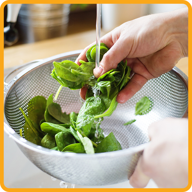 Person washing greens